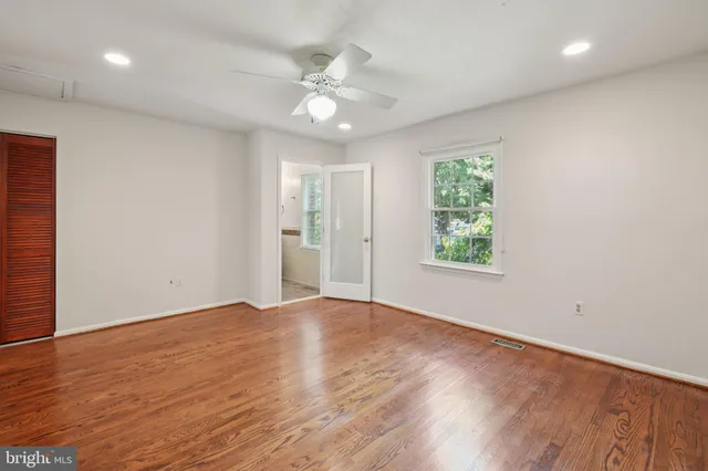 a picture of a bench in front of a wall