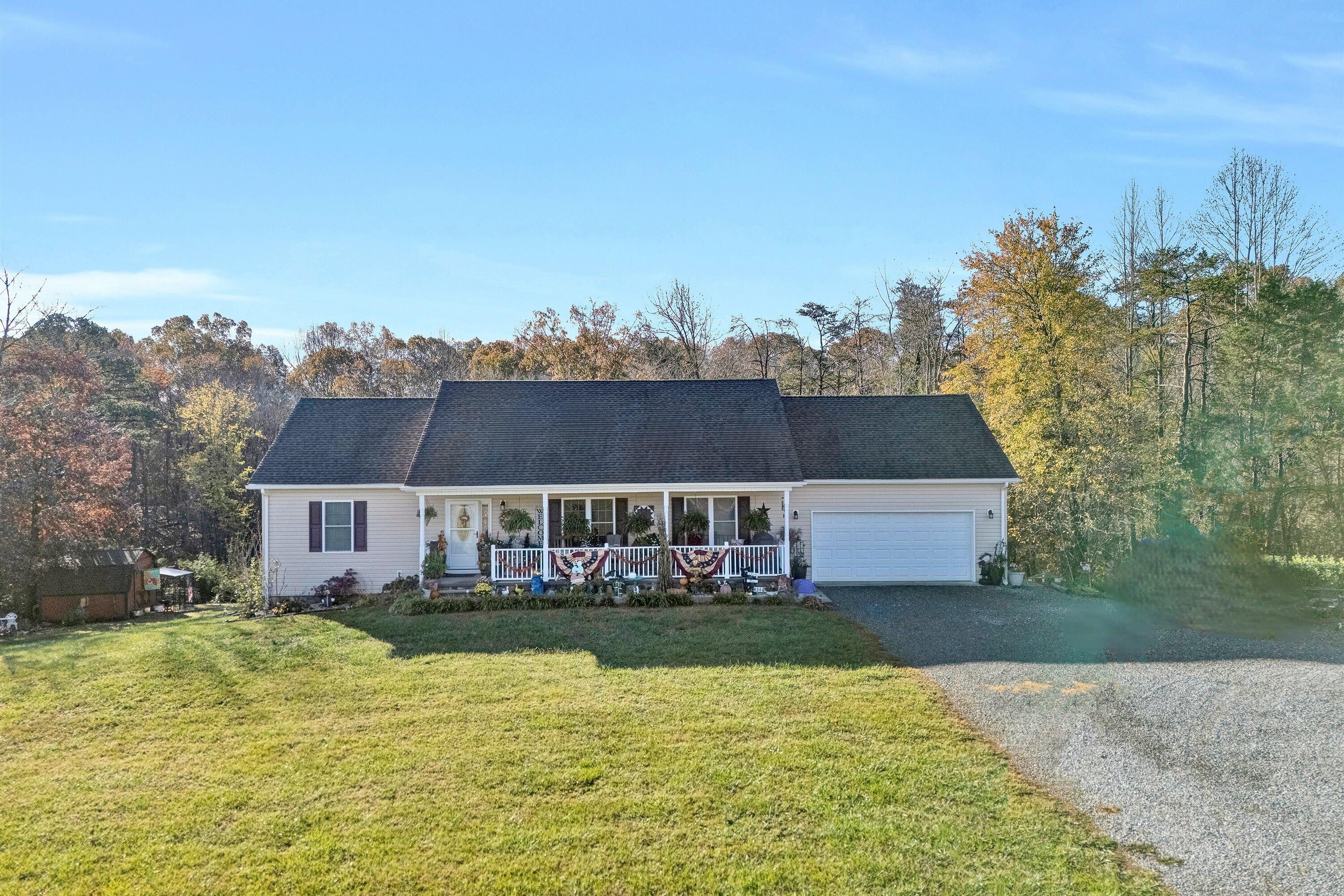 a view of house with outdoor space and swimming pool