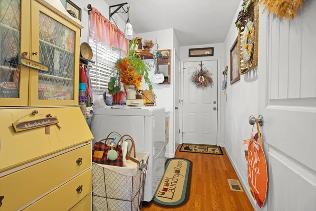 a utility room with multiple dryer and washer