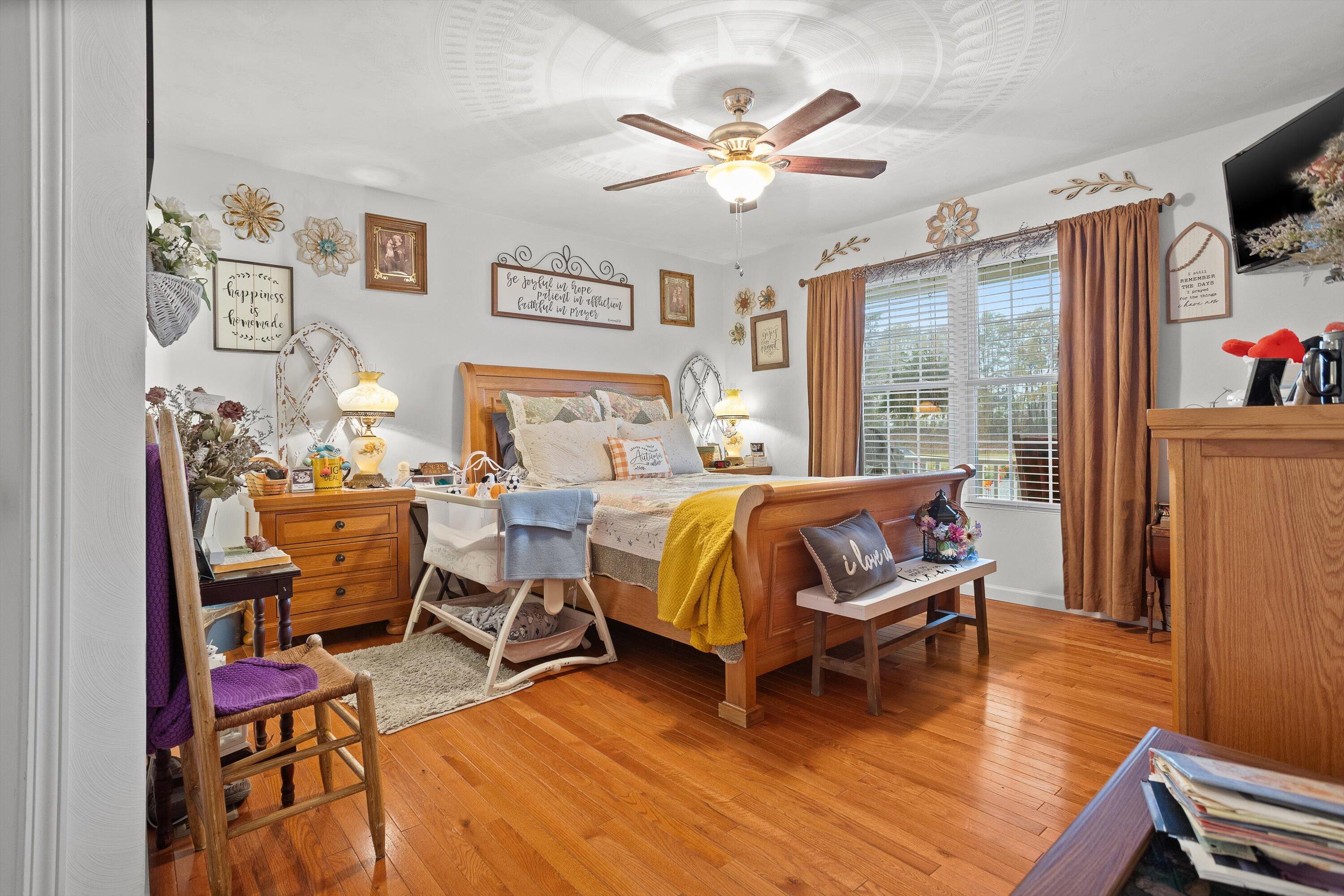 4348 Stewartsville Road Moneta, VA 24121 - Photo 13 of 29 a bedroom with a bed and wooden floor