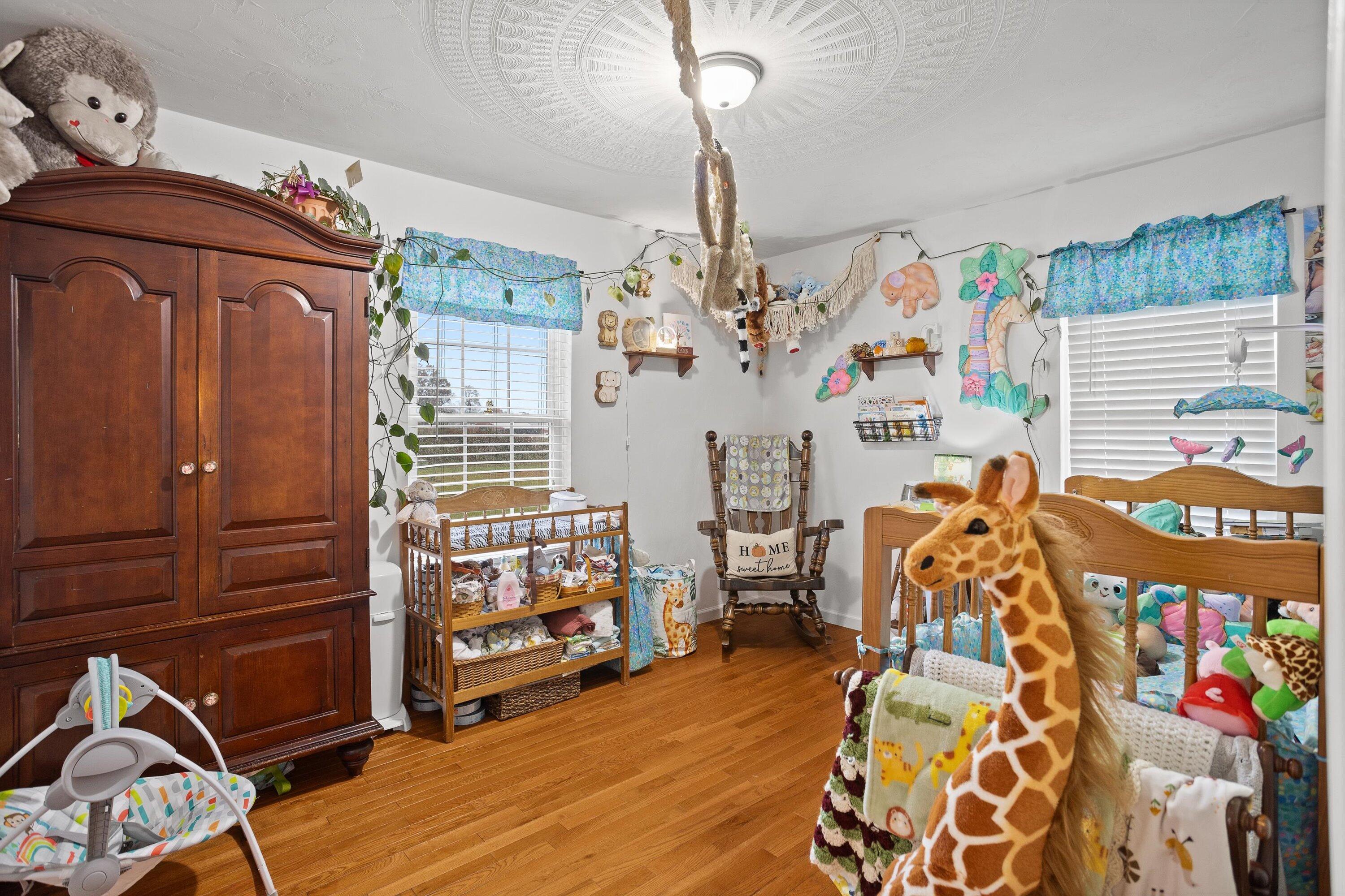 4348 Stewartsville Road Moneta, VA 24121 - Photo 16 of 29 a view of a room with wooden floor and windows