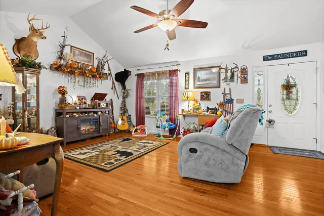 a living room with furniture and a table