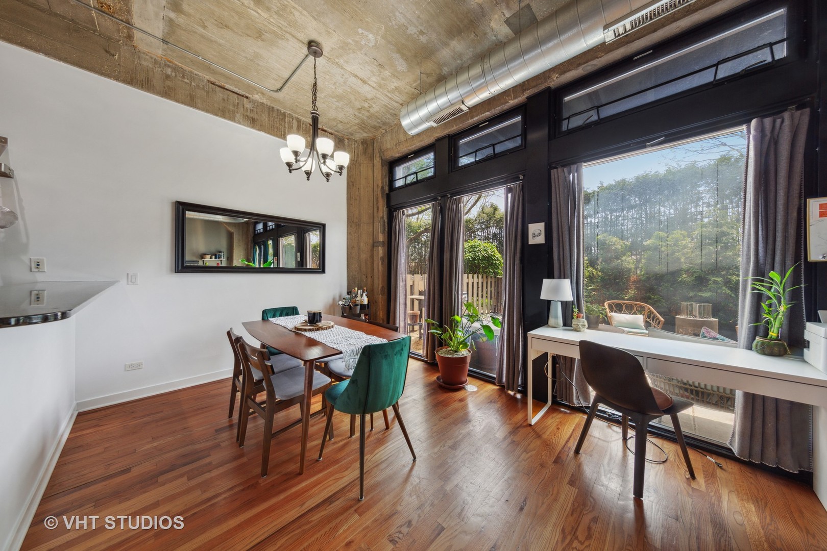 1111 West 15th Street, Unit 115 Chicago, IL 60608 - Photo 12 of 22 a view of a dining room with furniture window and wooden floor