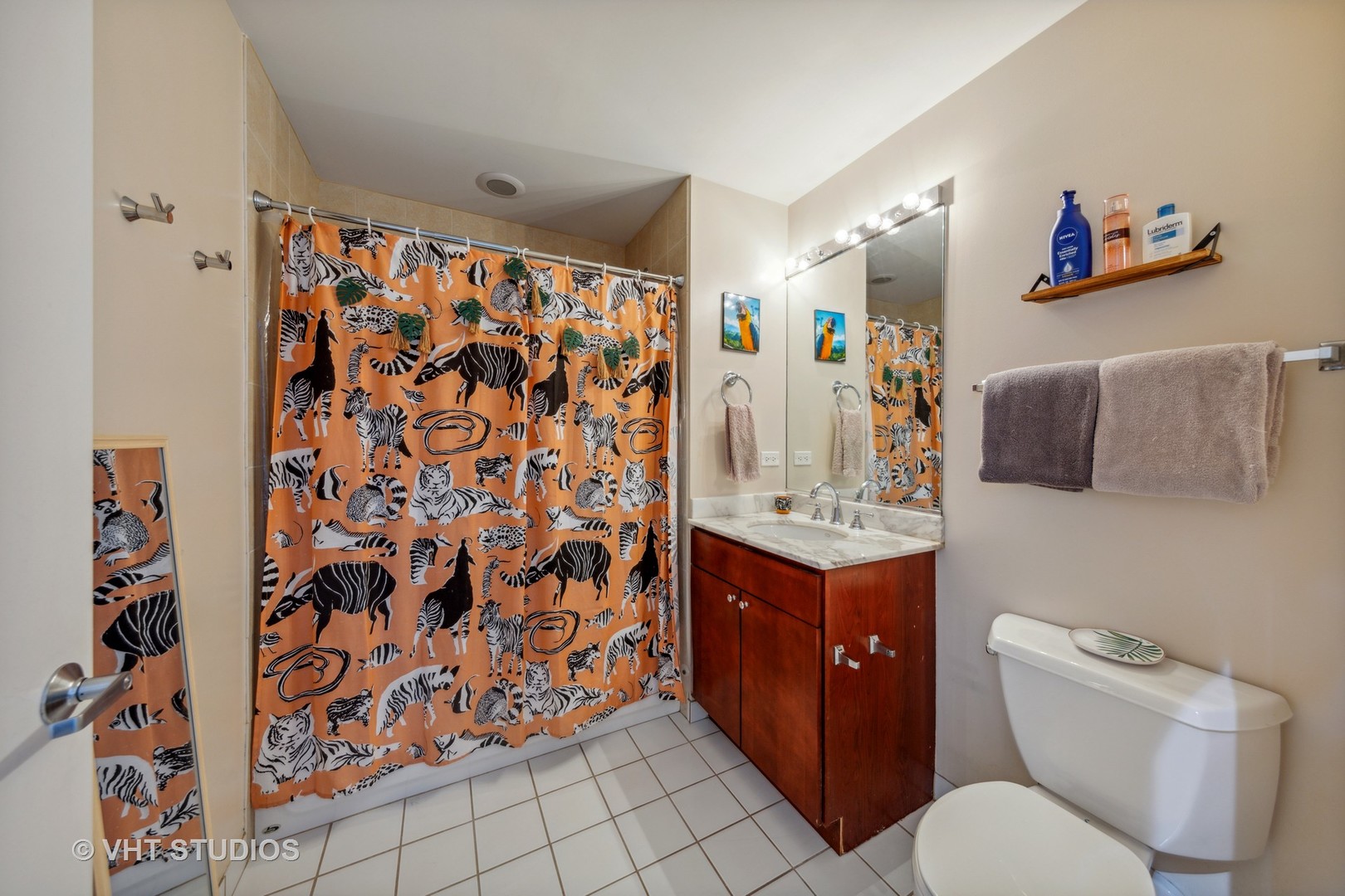 1111 West 15th Street, Unit 115 Chicago, IL 60608 - Photo 15 of 22 a bathroom with a toilet sink and mirror