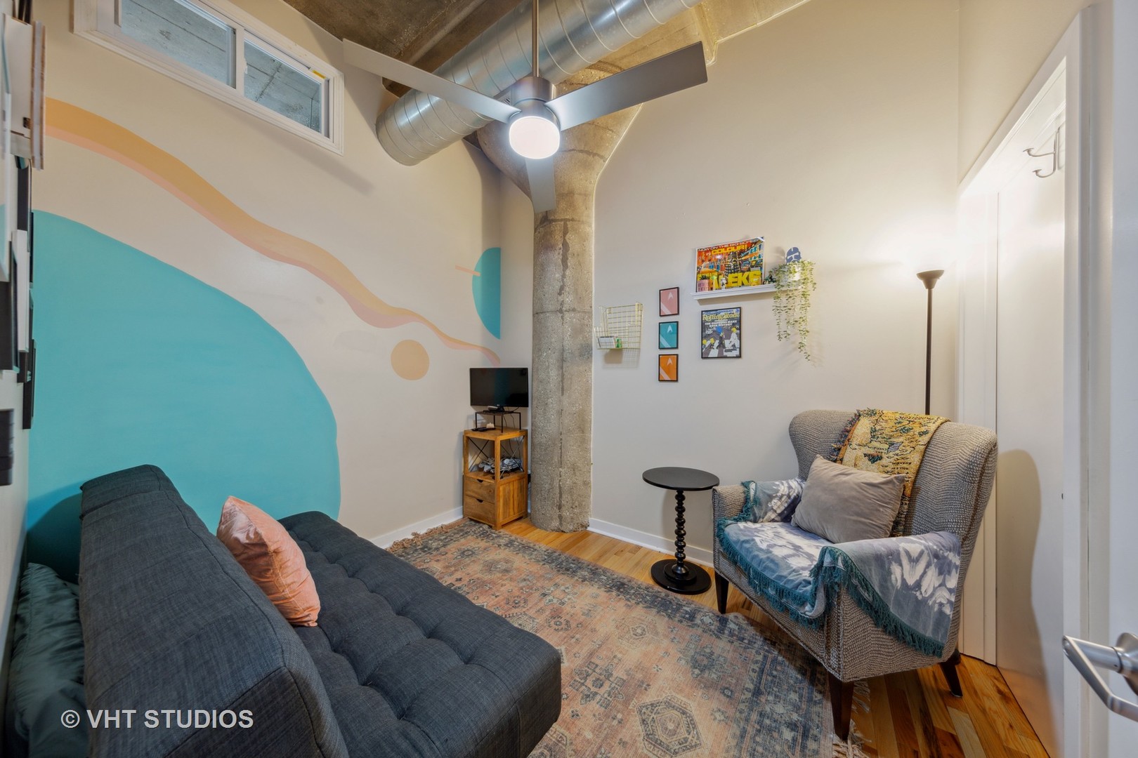 1111 West 15th Street, Unit 115 Chicago, IL 60608 - Photo 17 of 22 a living room with furniture and a rug