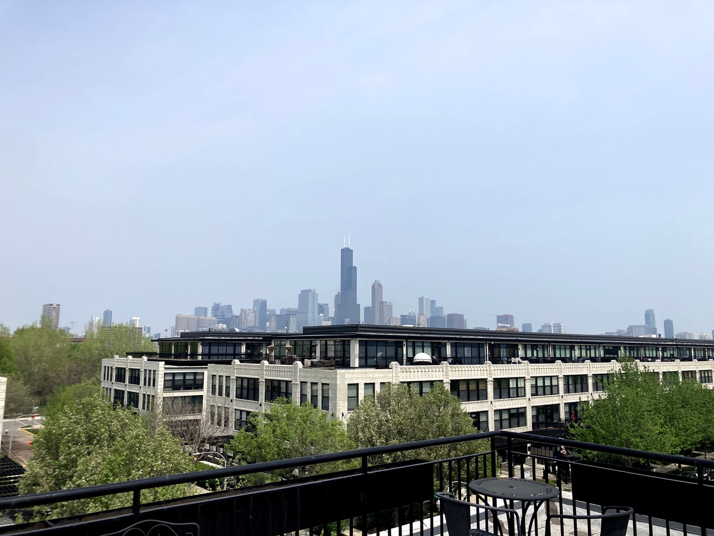 1111 West 15th Street, Unit 115 Chicago, IL 60608 - Photo 21 of 22 a view of a large building with a city view