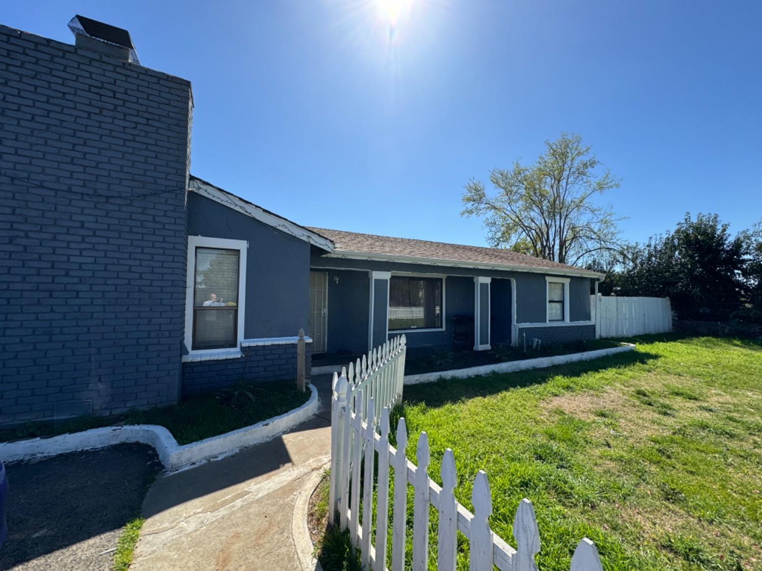 1474 Smith Road Yuba City, CA 95993 - Photo 2 of 12 a view of a house with a yard