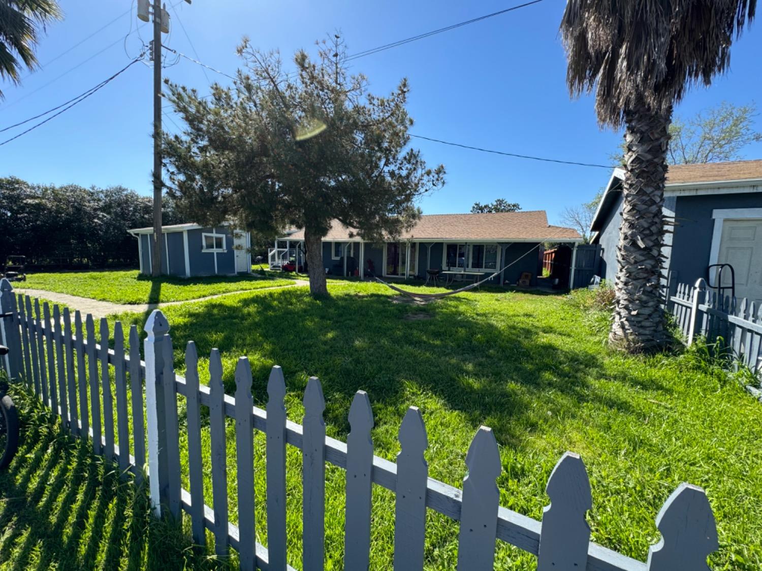 1474 Smith Road Yuba City, CA 95993 - Photo 10 of 12 a view of a house with backyard and porch