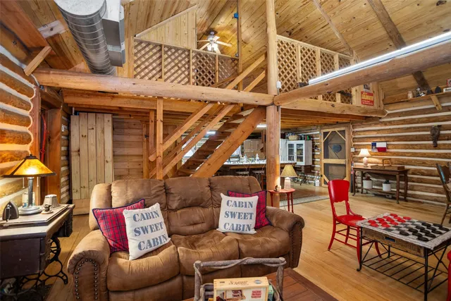 a dining room with furniture and a window