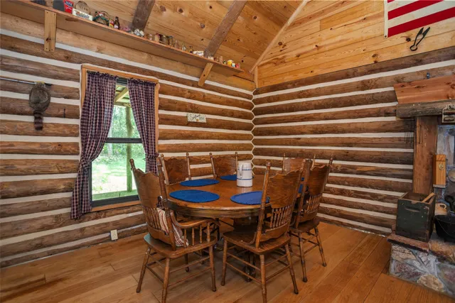 a living room with furniture a rug and white walls