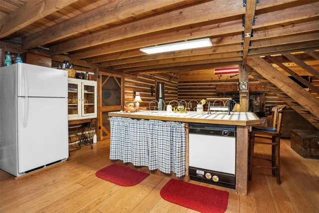 a view of dining room with a table and chairs