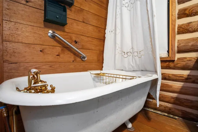 a bathroom with a sink a mirror and shower