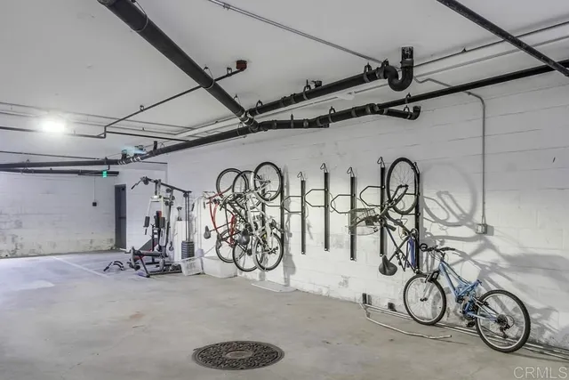 a view of parking garage with cars