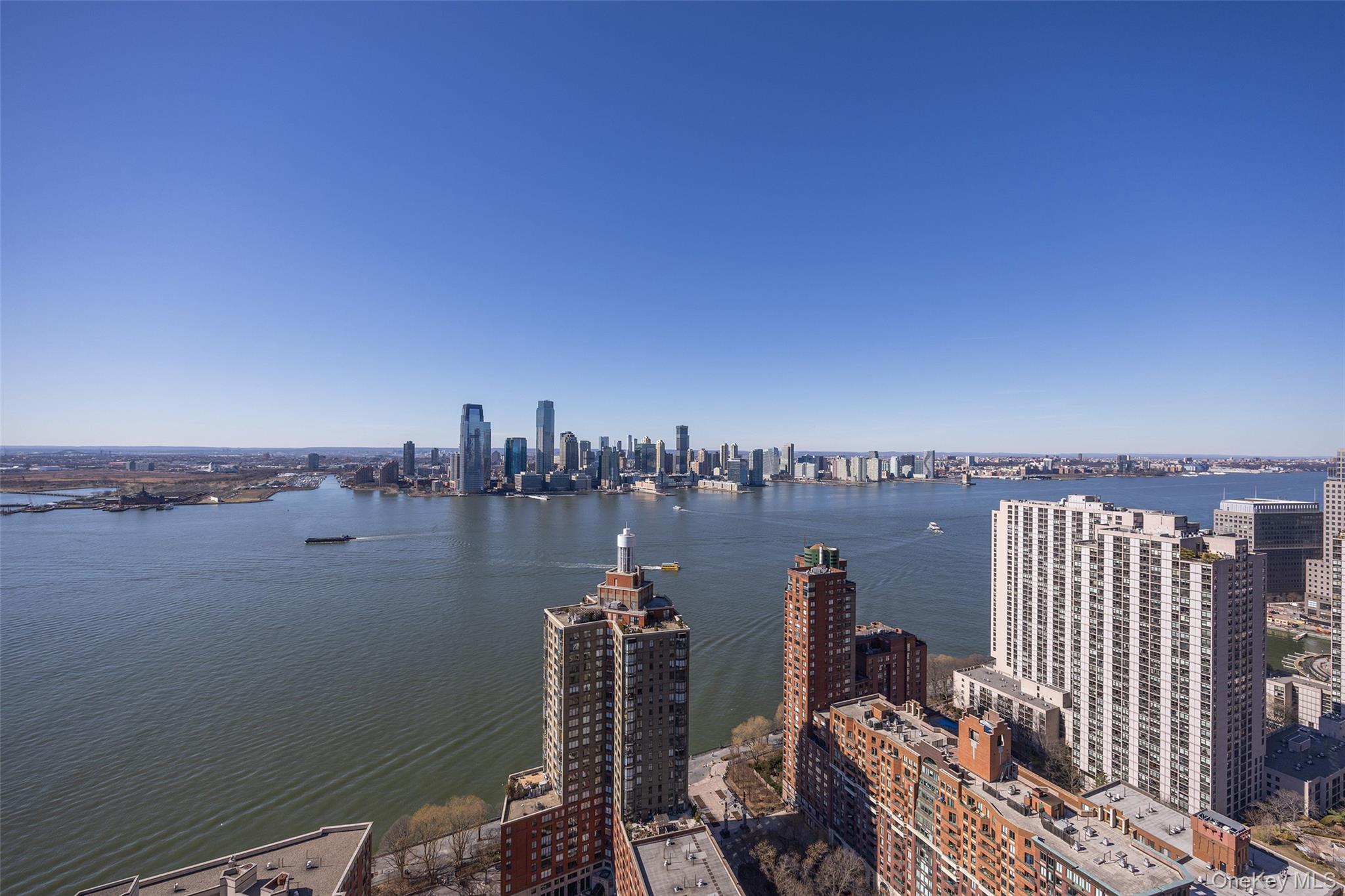 200 Rector Place, Unit 43D Manhattan, NY 10280 - Photo 25 of 27 a view of a city from a lake