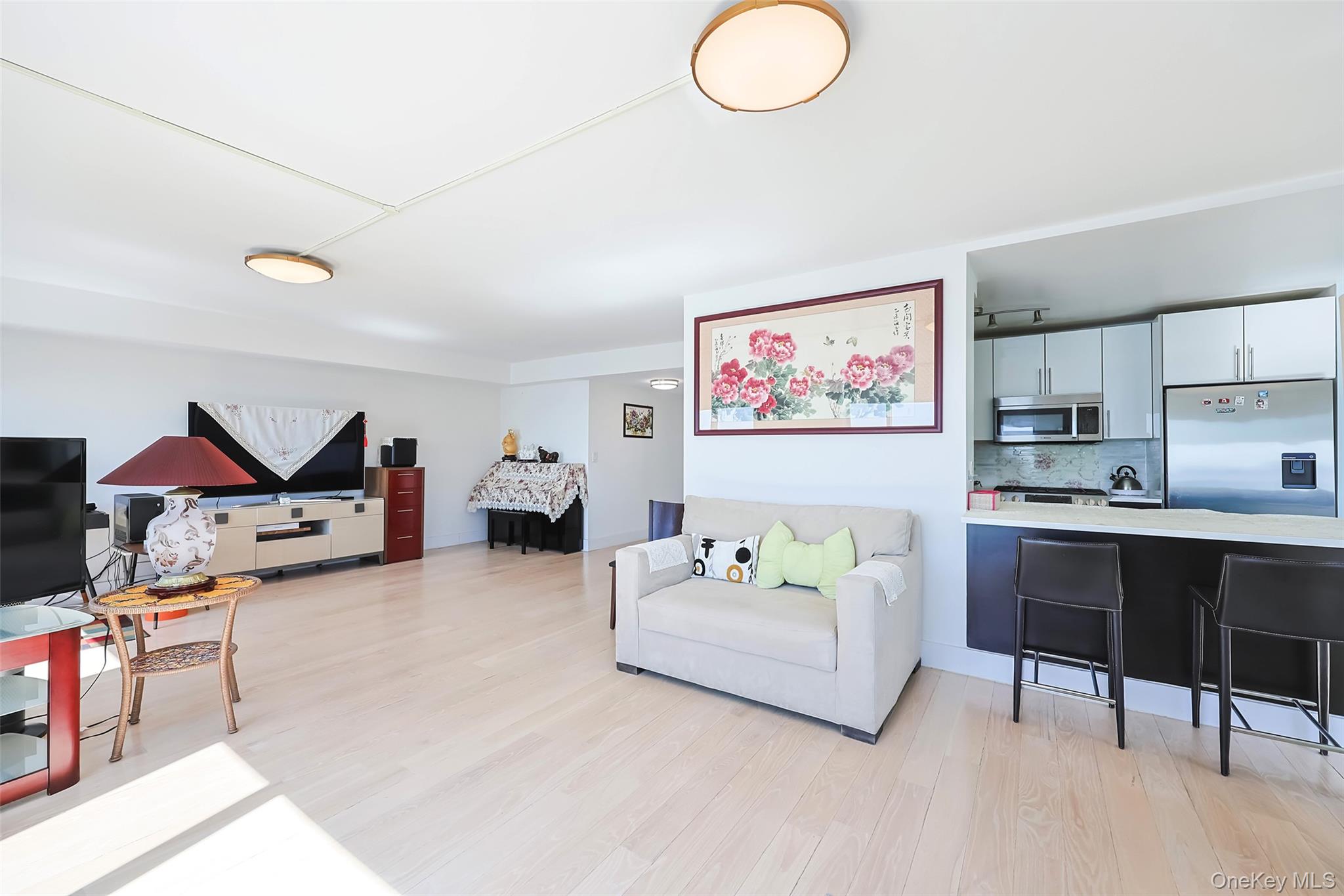200 Rector Place, Unit 43D Manhattan, NY 10280 - Photo 6 of 27 a spacious bedroom with a bed furniture and a window