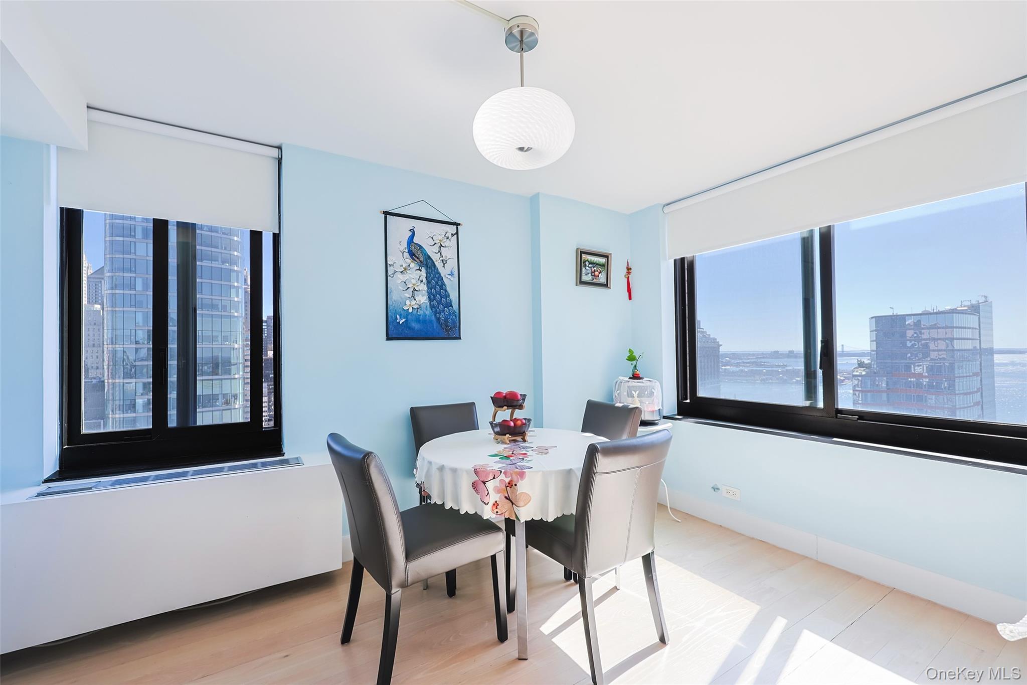 200 Rector Place, Unit 43D Manhattan, NY 10280 - Photo 9 of 27 a dining room with furniture and window