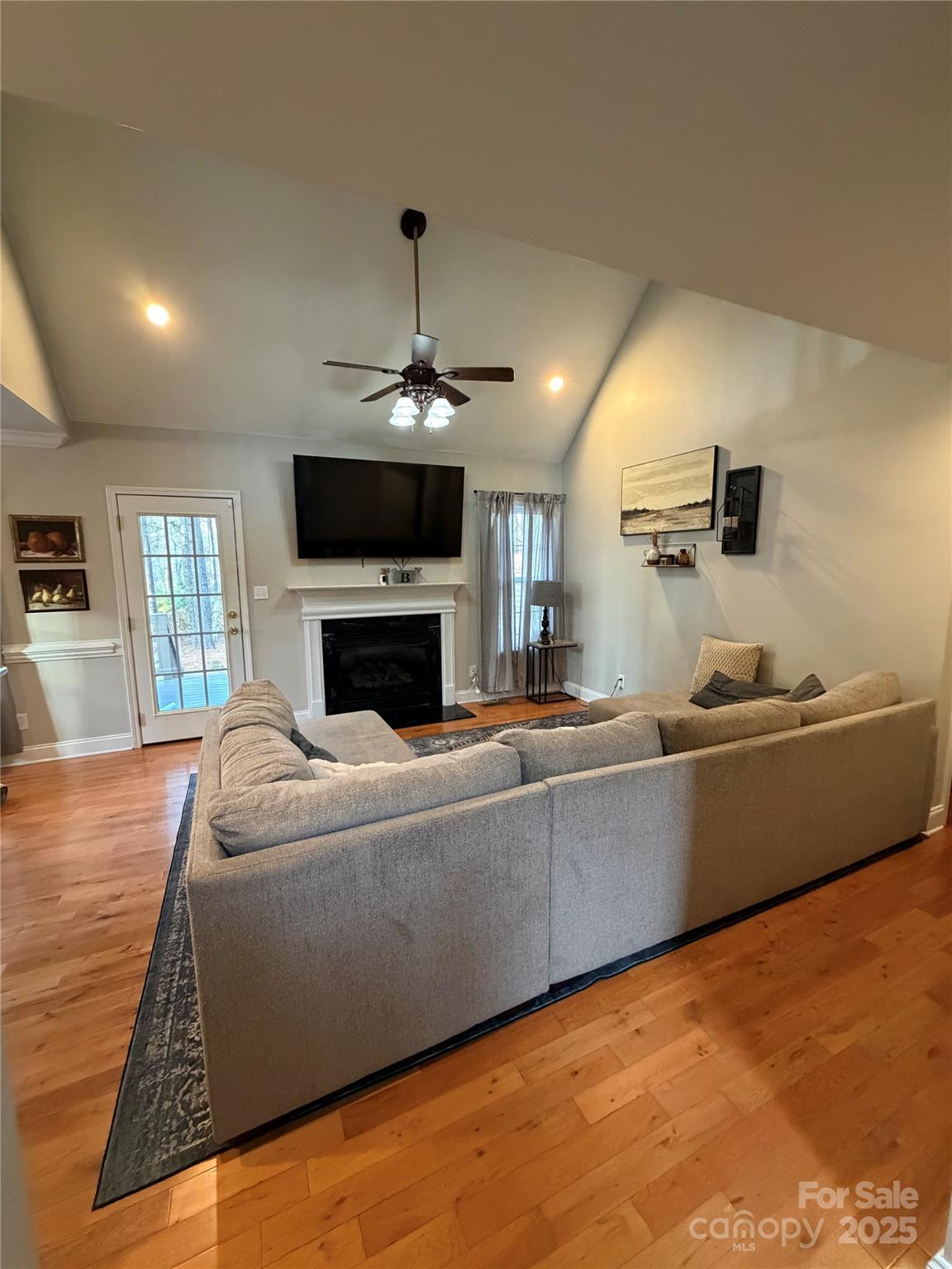316 Durham Road Stanley, NC 28164 - Photo 11 of 16 a living room with furniture and a fireplace