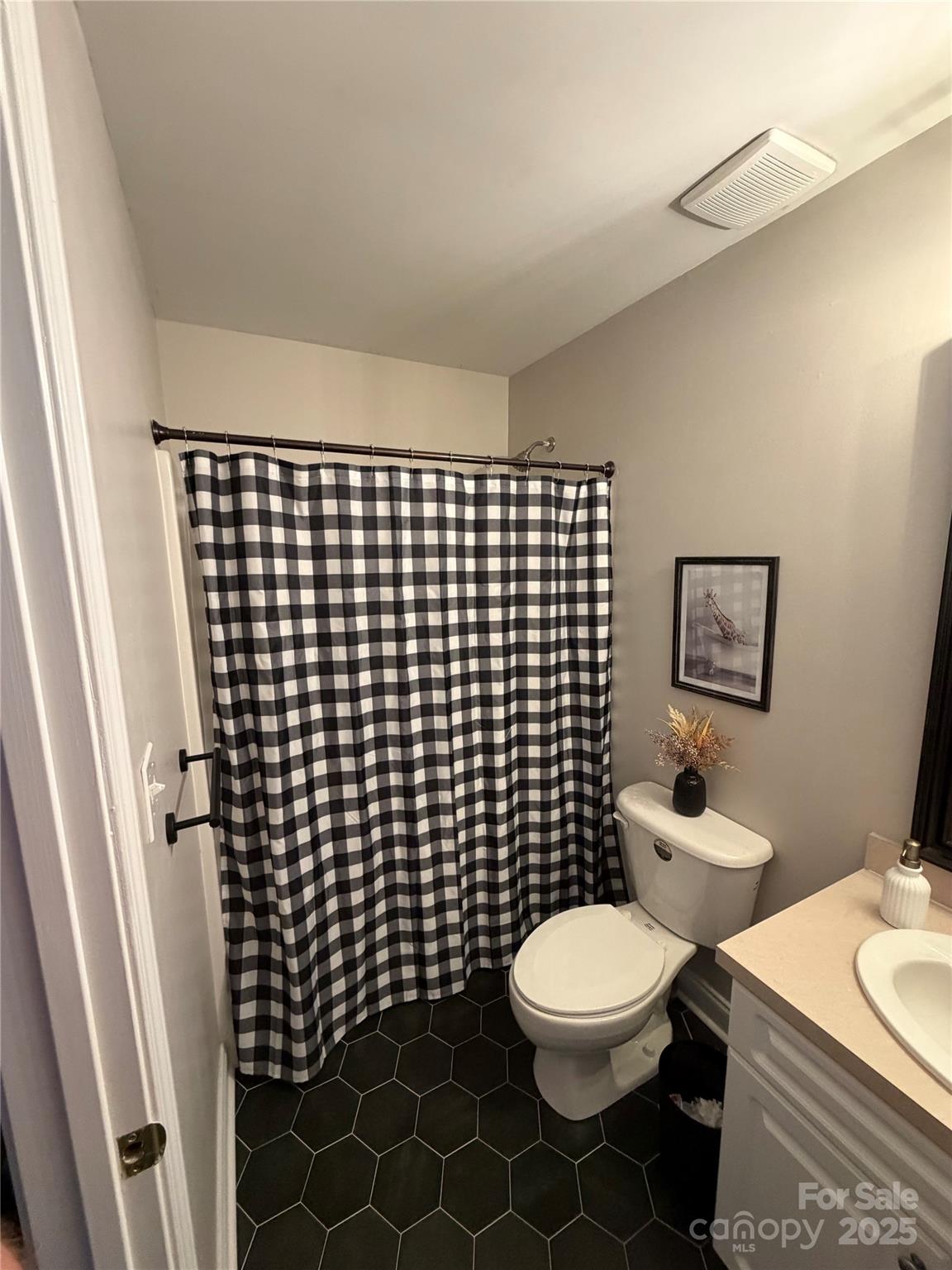316 Durham Road Stanley, NC 28164 - Photo 15 of 16 a bathroom with a toilet and a mirror