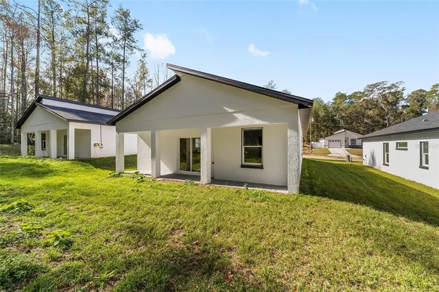 a view of a swimming pool and trees in the background