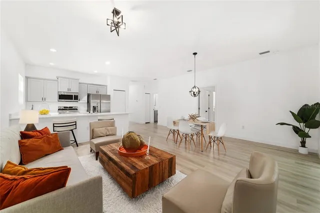 a living room with furniture and a table