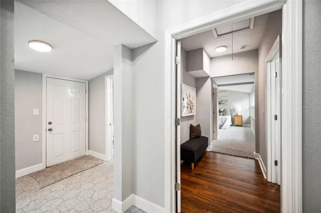 a bathroom with a granite countertop bathtub and shower