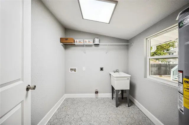 a kitchen with a table and chairs in it