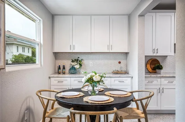 a view of a hallway with wooden floor and closet