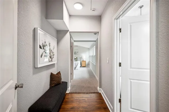 a spacious bathroom with a double vanity sink a toilet a shower and a window