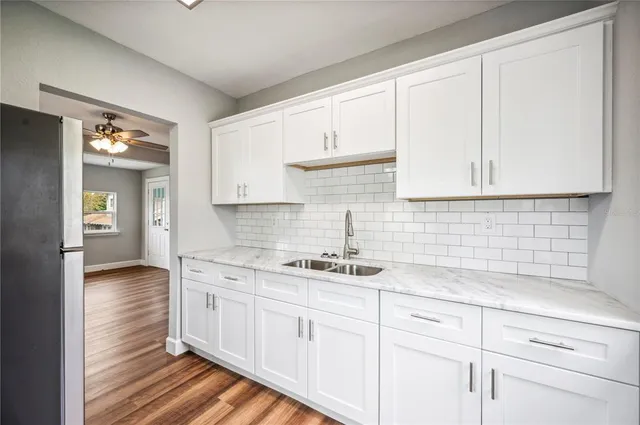 a front view of a house with swimming pool having outdoor seating