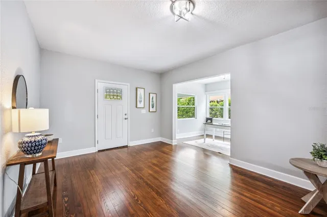 a living room with a large window and a table