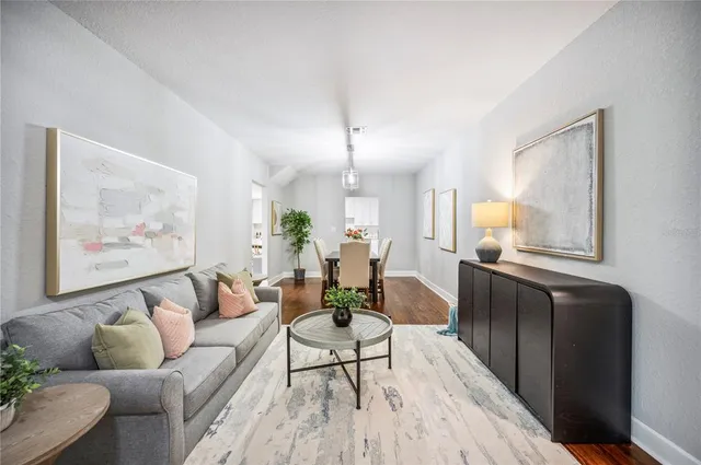 a kitchen with a stove a sink a dining table and chairs