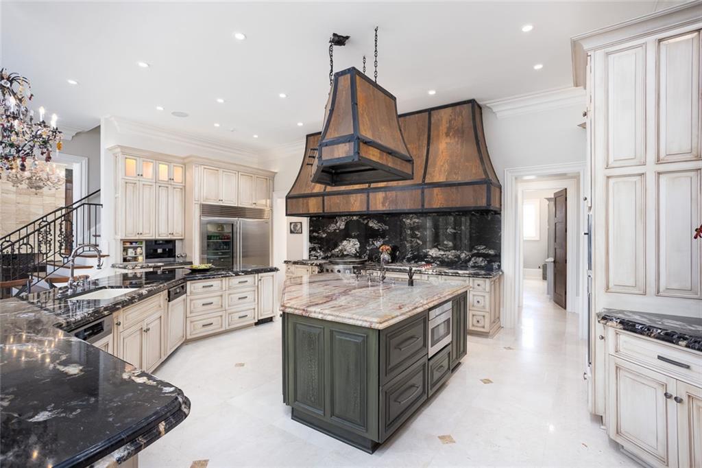 3084 George Williams Road Monroe, GA 30656 - Photo 12 of 55 a kitchen with stainless steel appliances granite countertop a stove oven and a refrigerator