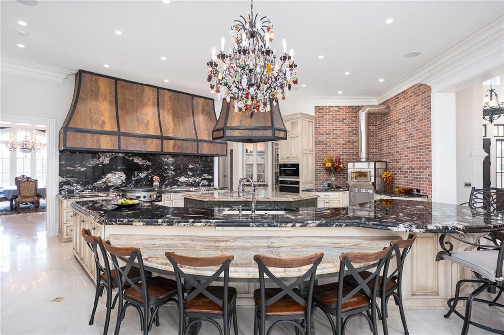 3084 George Williams Road Monroe, GA 30656 - Photo 14 of 55 a kitchen with a table and chairs
