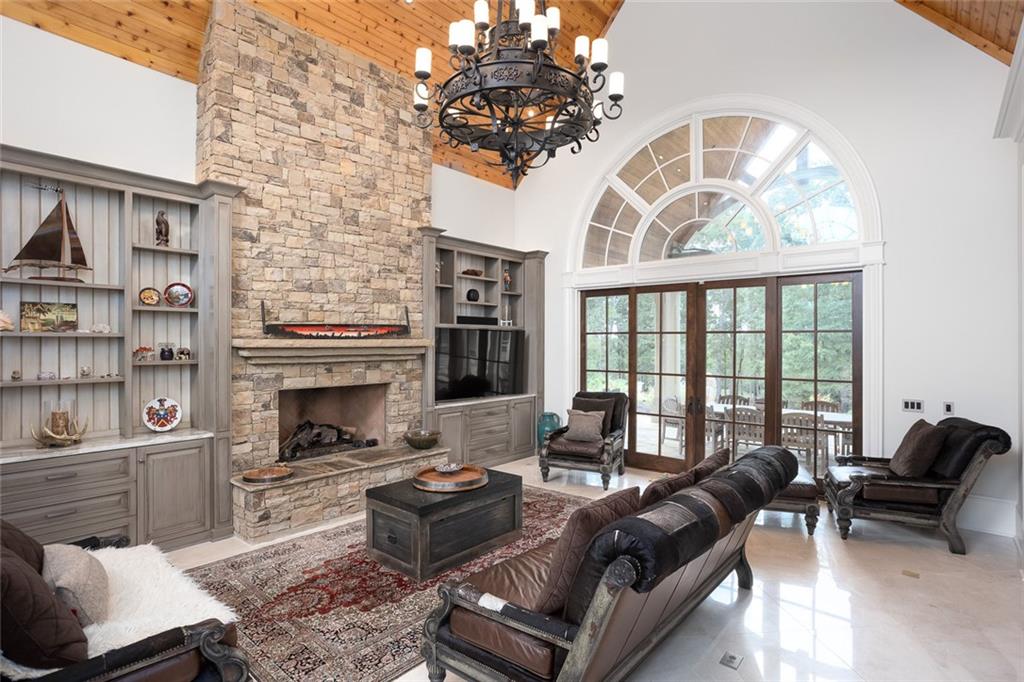 3084 George Williams Road Monroe, GA 30656 - Photo 15 of 55 a living room with furniture a fireplace and a chandelier