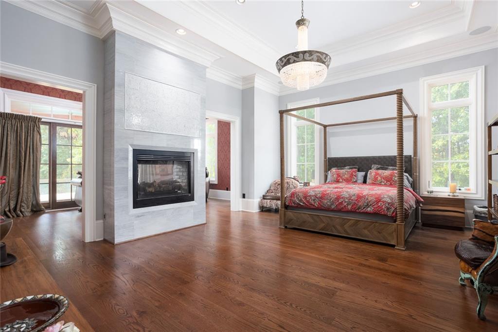 3084 George Williams Road Monroe, GA 30656 - Photo 19 of 55 a bedroom with a bed and wooden floor