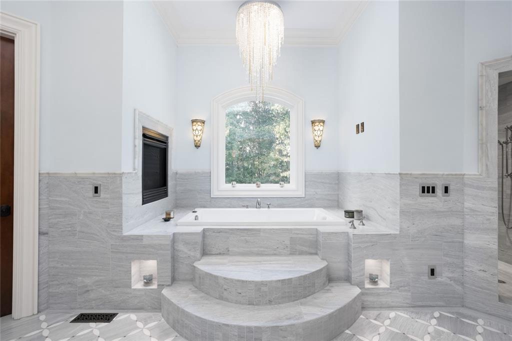 3084 George Williams Road Monroe, GA 30656 - Photo 24 of 55 a bath room with a window and a fireplace