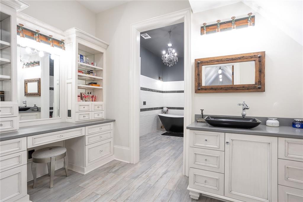 3084 George Williams Road Monroe, GA 30656 - Photo 35 of 55 a kitchen with granite countertop a sink and cabinets