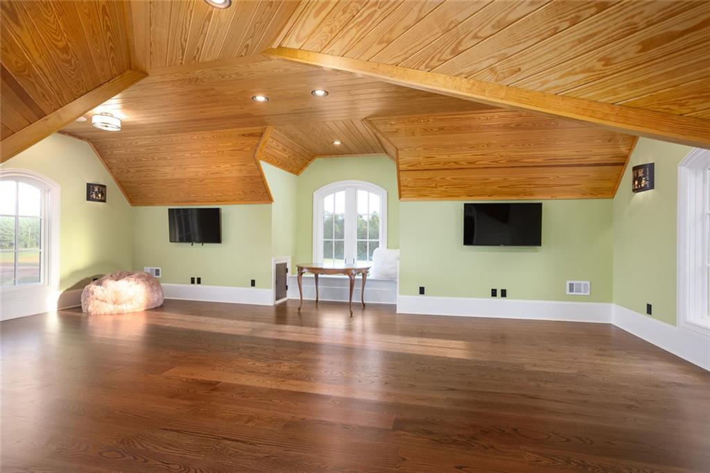 3084 George Williams Road Monroe, GA 30656 - Photo 39 of 55 an empty room with wooden floor and windows