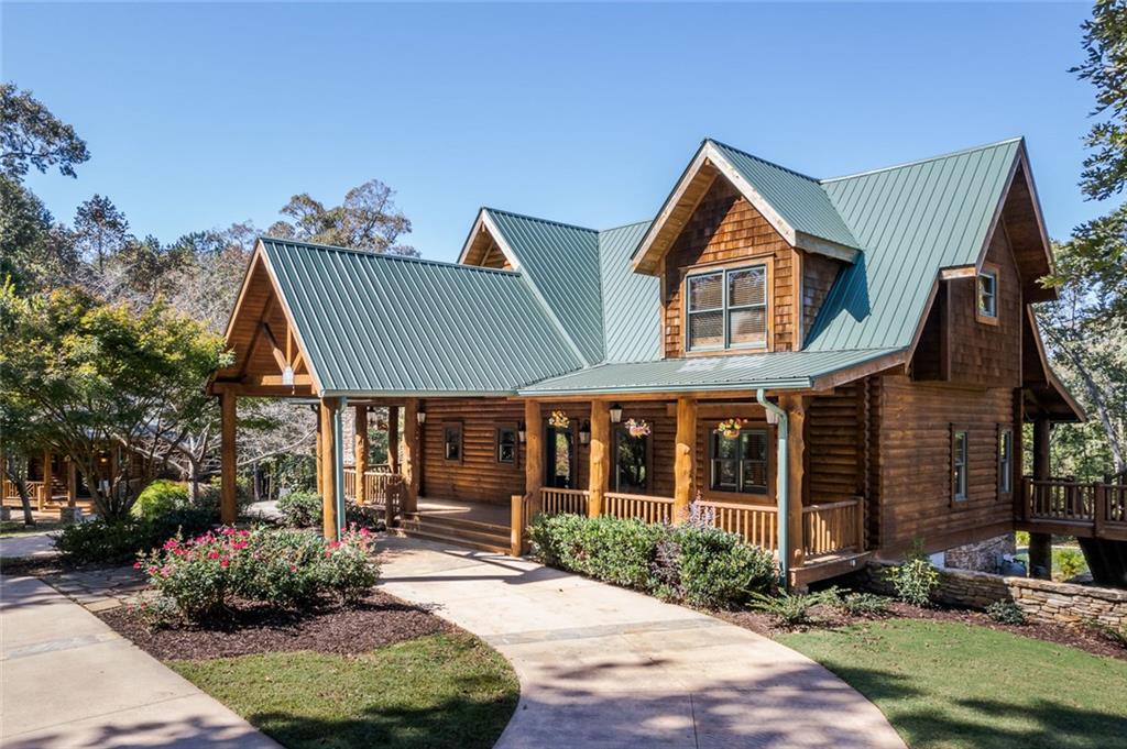 3084 George Williams Road Monroe, GA 30656 - Photo 40 of 55 a front view of a house with garden