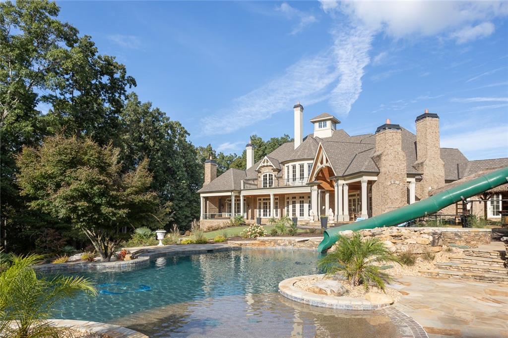 3084 George Williams Road Monroe, GA 30656 - Photo 4 of 55 a front view of a house with a yard table and chairs