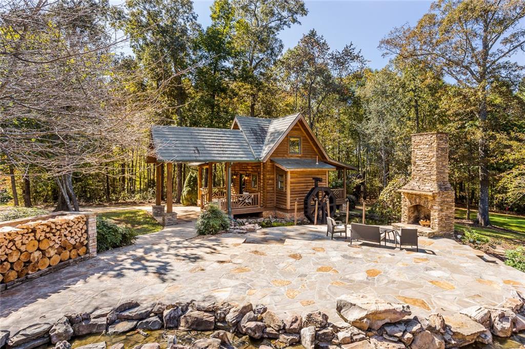 3084 George Williams Road Monroe, GA 30656 - Photo 48 of 55 a view of a blue house with yard and sitting area