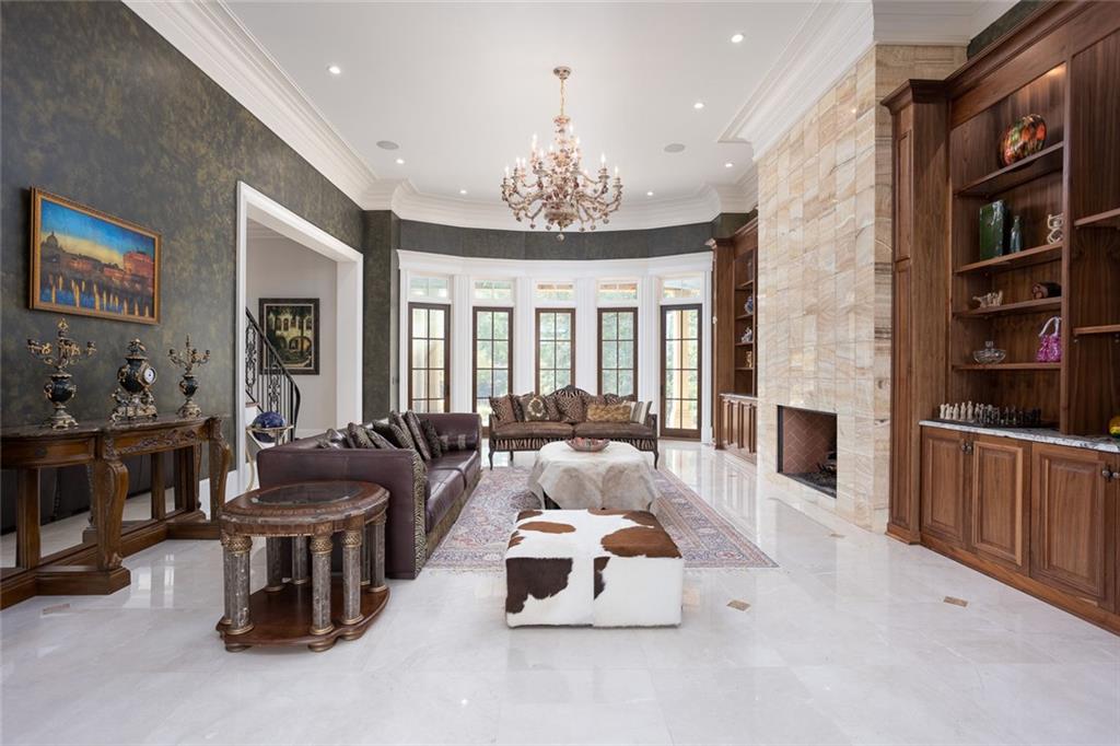 3084 George Williams Road Monroe, GA 30656 - Photo 9 of 55 a living room with furniture fireplace and chandelier