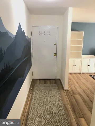 a bathroom with a toilet and bathtub