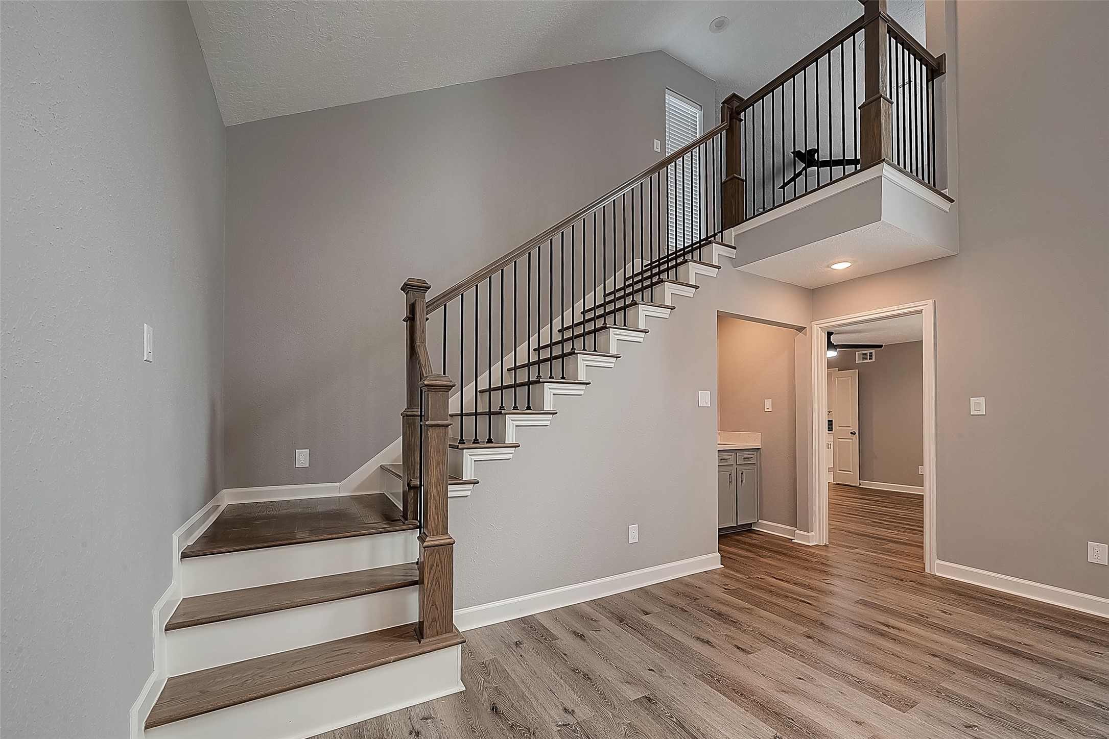 1623 Cherry Ridge Drive Houston, TX 77077 - Photo 22 of 44 a view of entryway and hall with wooden floor