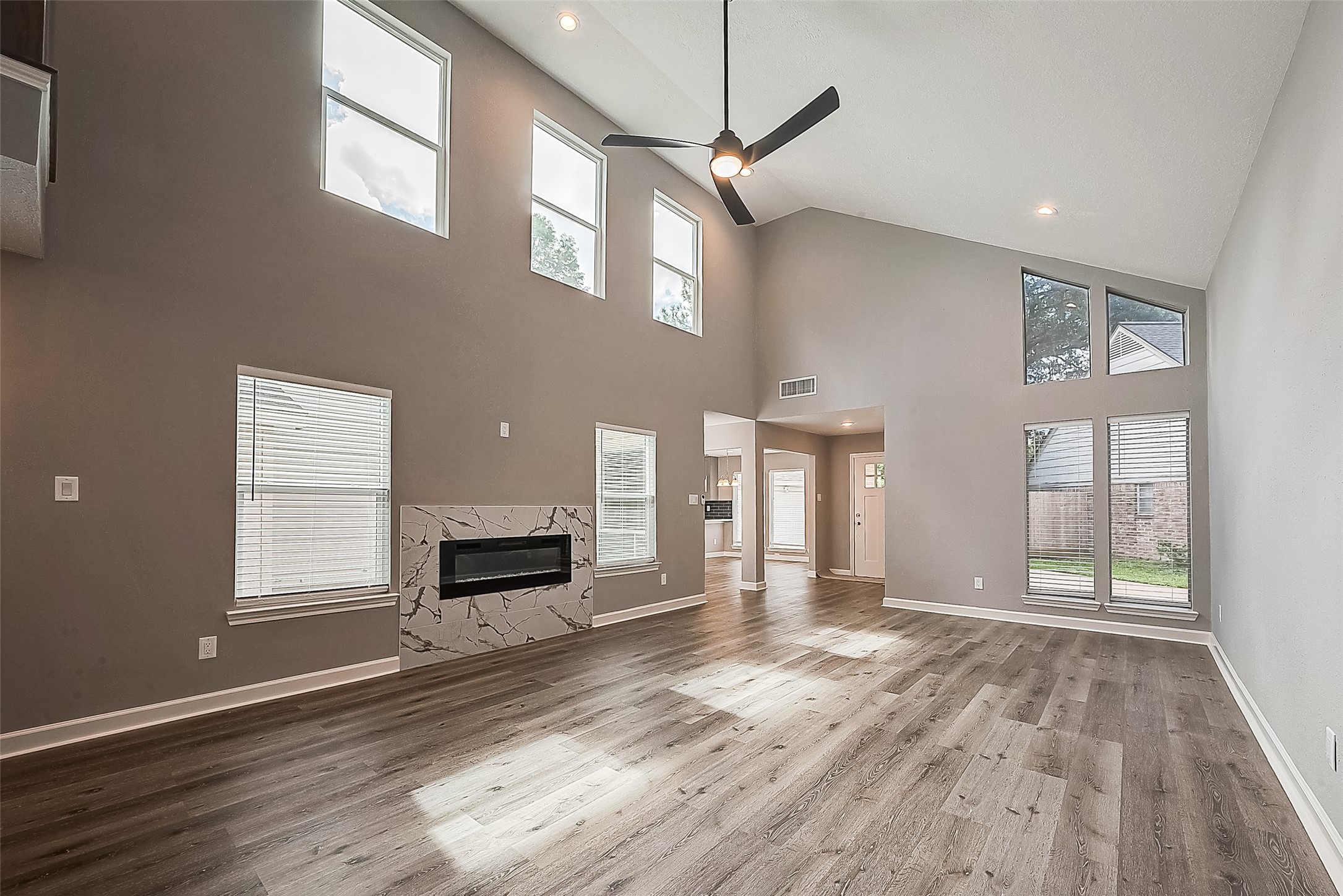 1623 Cherry Ridge Drive Houston, TX 77077 - Photo 23 of 44 a view of a livingroom with wooden floor and a ceiling fan