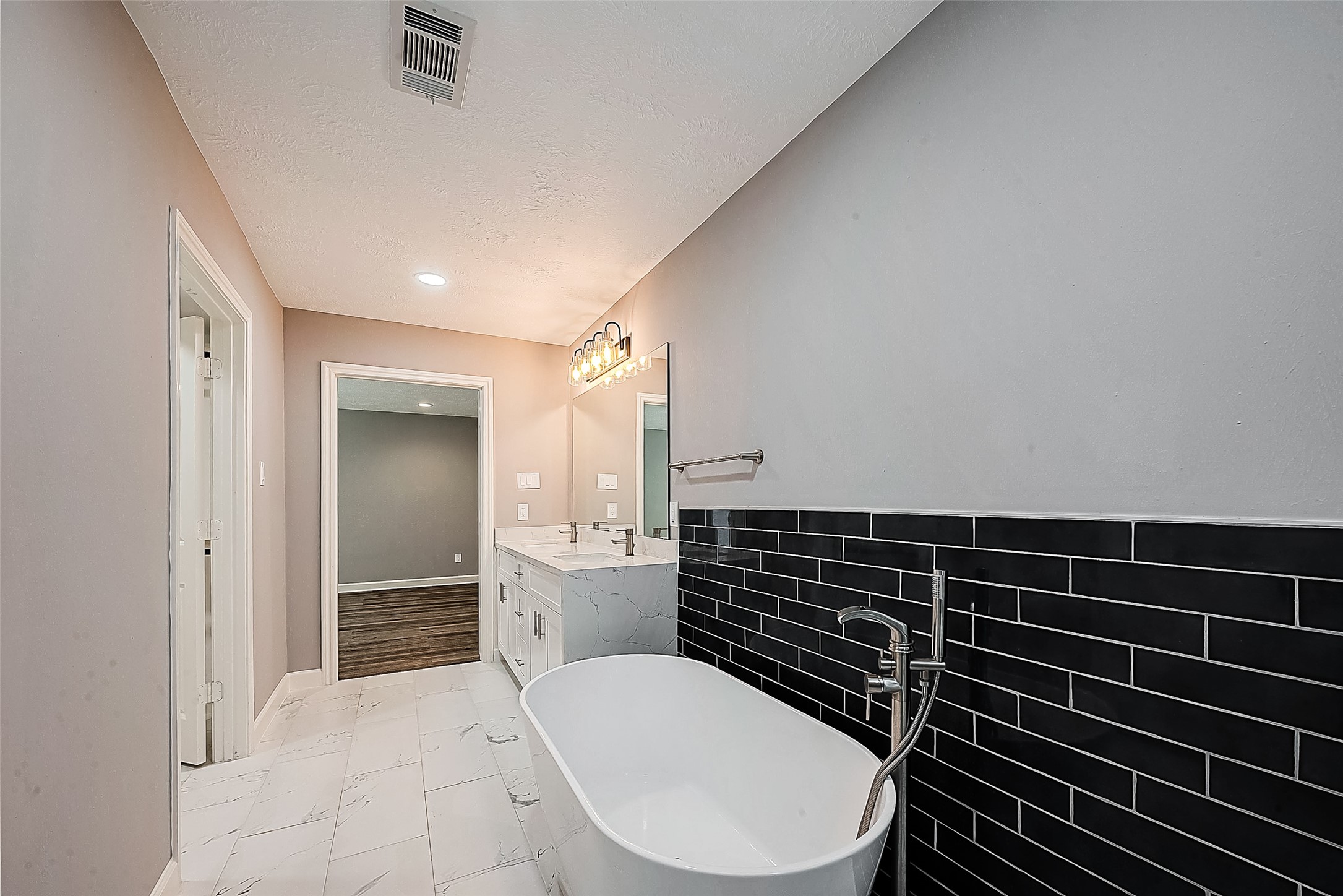 1623 Cherry Ridge Drive Houston, TX 77077 - Photo 30 of 44 a bathroom with a toilet a sink and a shower