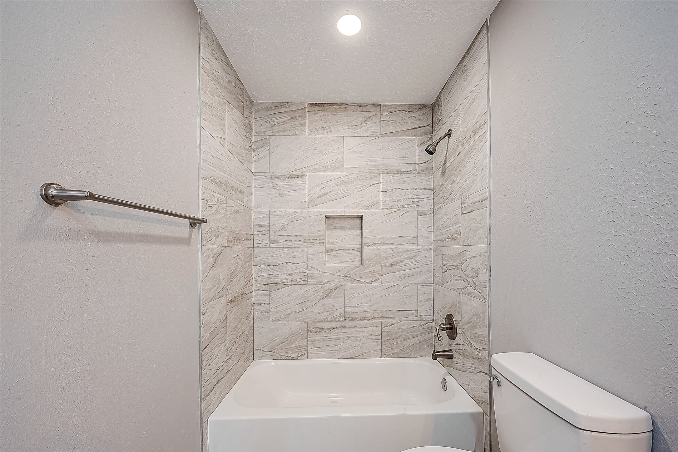 1623 Cherry Ridge Drive Houston, TX 77077 - Photo 36 of 44 a bathroom with a bathtub and a toilet