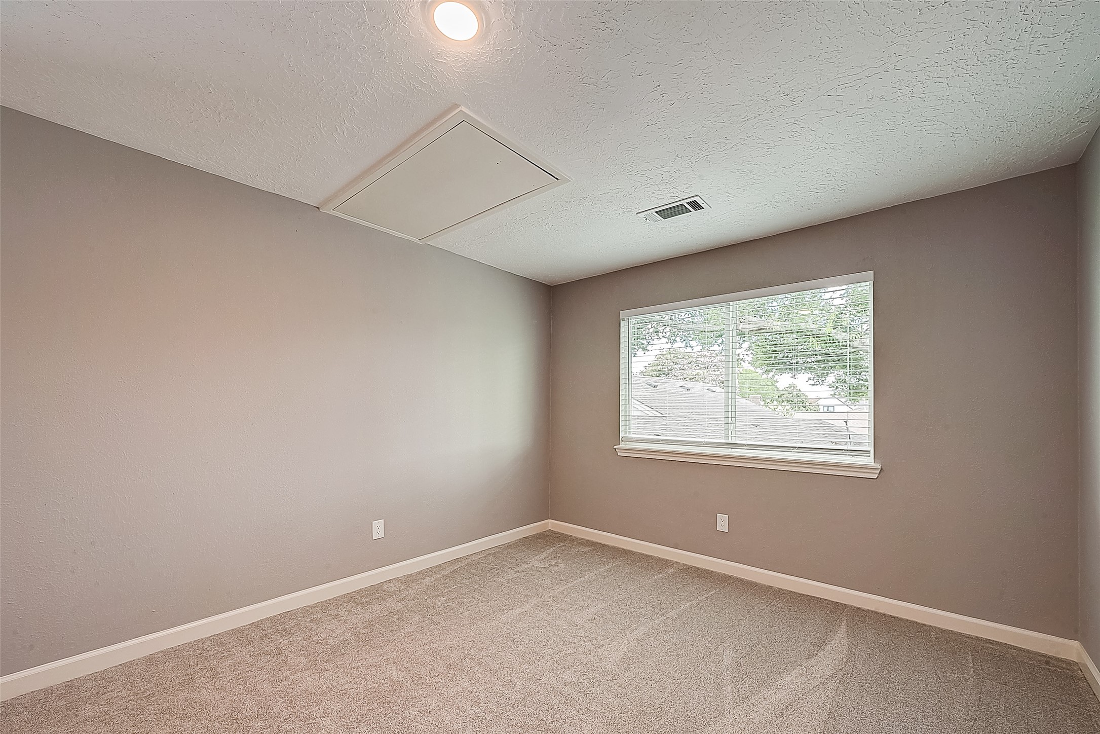 1623 Cherry Ridge Drive Houston, TX 77077 - Photo 39 of 44 an empty room with a window