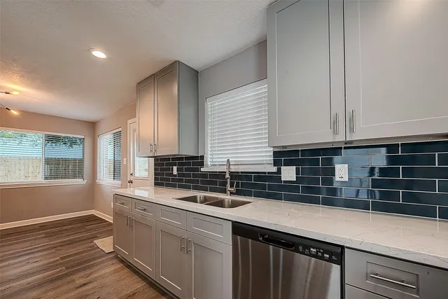 a kitchen that has a sink and a window