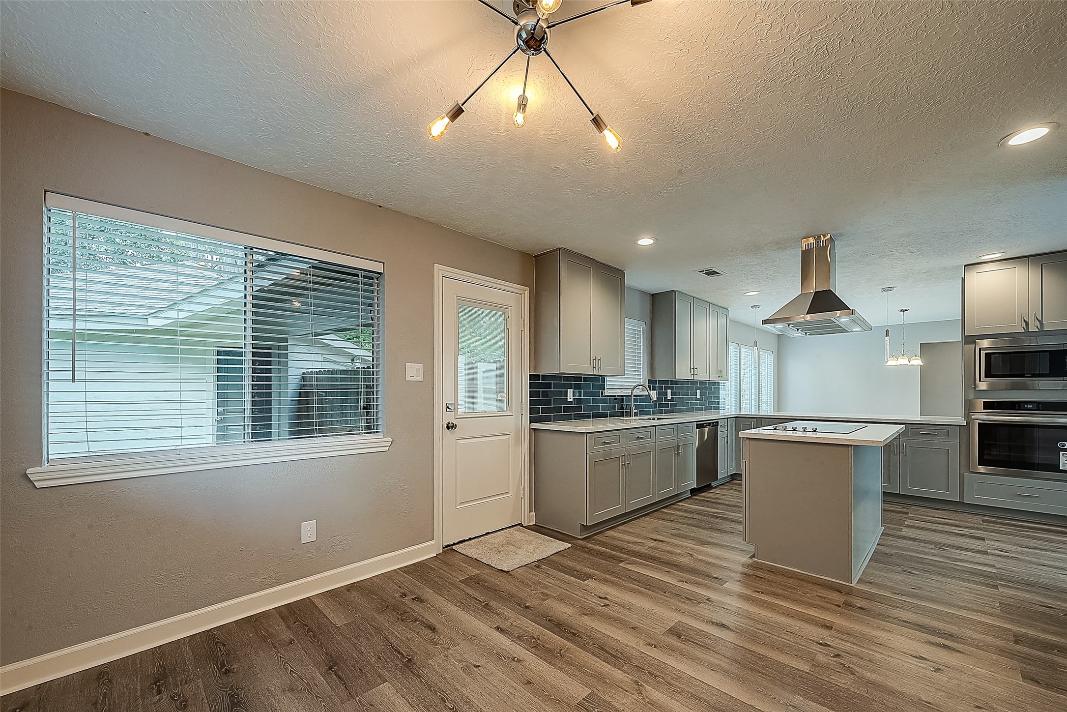1623 Cherry Ridge Drive Houston, TX 77077 - Photo 10 of 44 a kitchen with a refrigerator and a sink